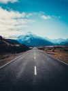 road near mountain during daytime